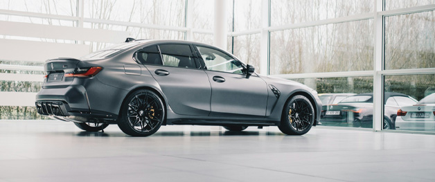 stockphoto grey sedan in showroom